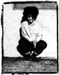 [A young Jon, 
with big hair, crouching in front of a wall]