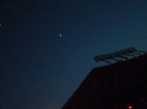 Moon and Jupiter over Arrowhead Stadium