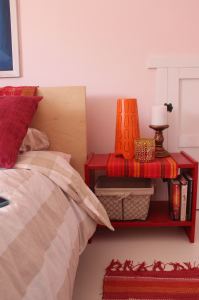 The painted red table is easier to clean than the old unfinished pine.  The basket on the lower shelf hides things that might otherwise be messy.