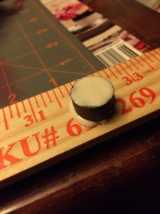 Put wood glue on top of the stack of magnets.