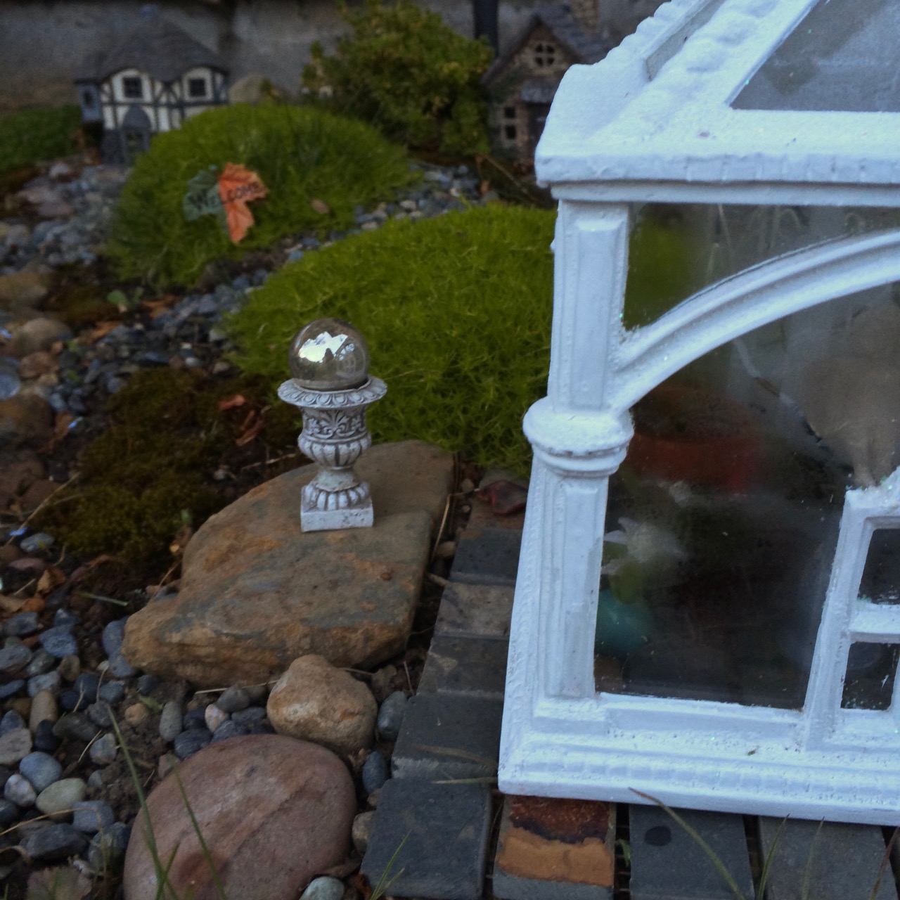 A gazing globe outside the conservatory.