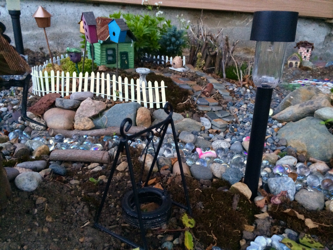 Another look through the village. There is a house made of twigs in the background.